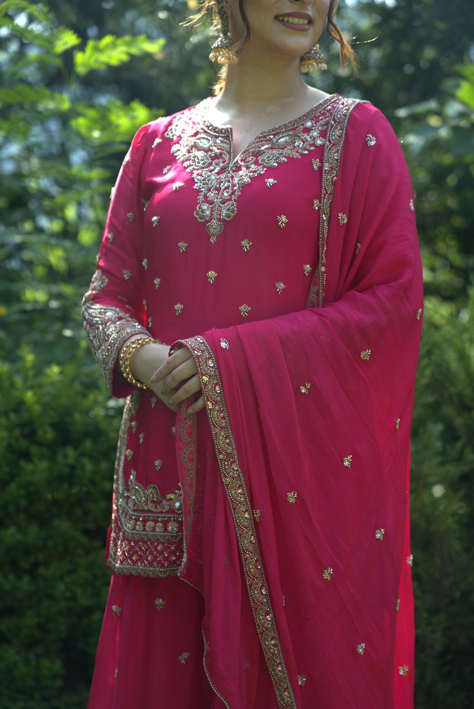 Fuchsia suit neckline and cuff detail