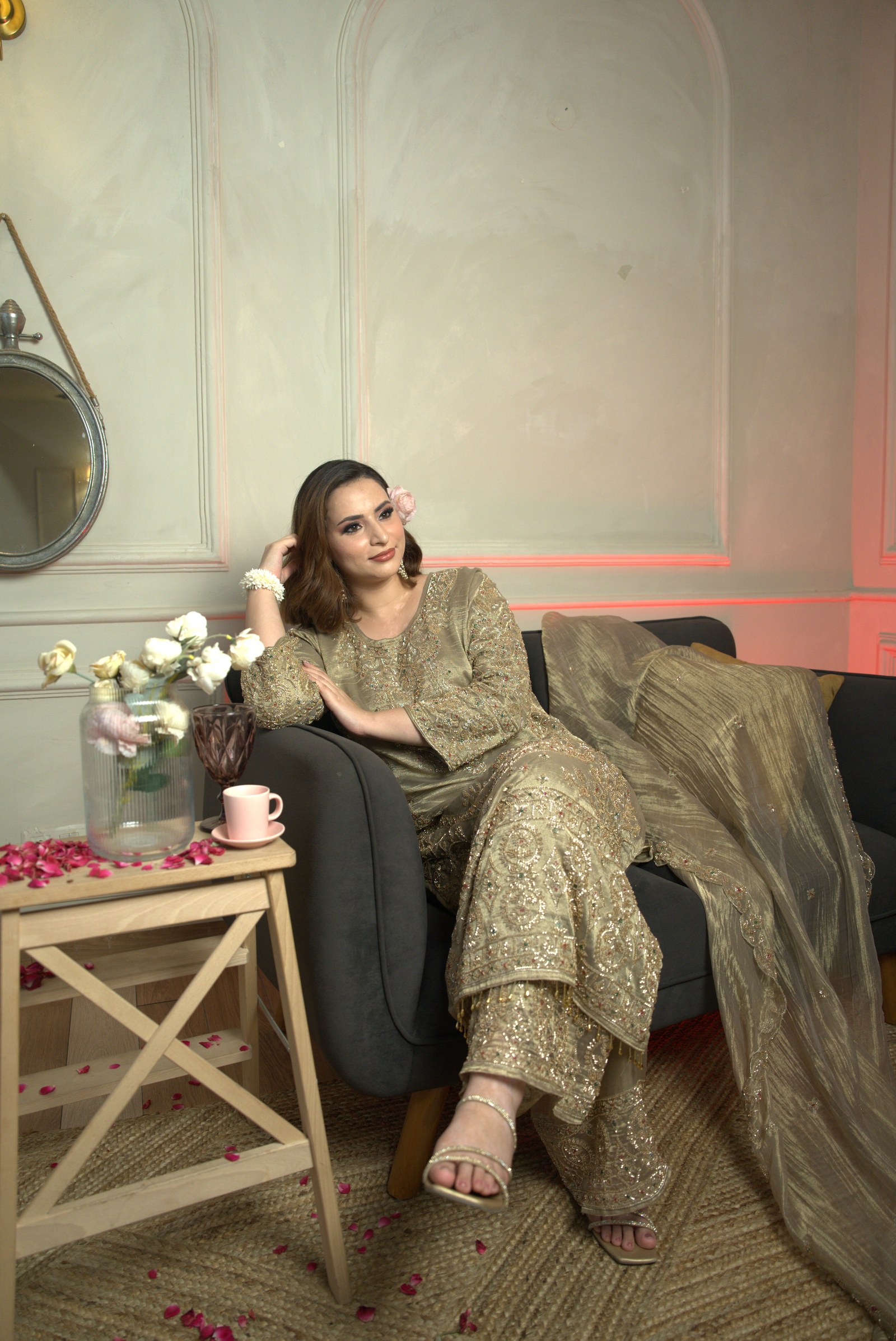 The olive-gold suit photographed seated, with the full dupatta visible